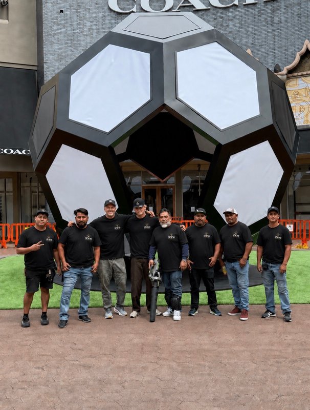 The Shine Illumination installation crew posing in front of the completed soccer ball